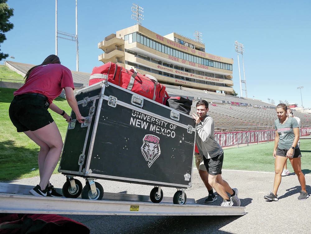 Small army of movers gets Lobos’ gear on road